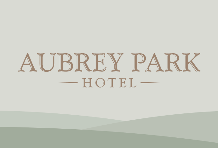 Aubrey Park with hotel parking logo